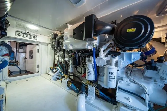  Yacht Photos Pics Engine room of a 1997 Garlington Convertible boat, featuring CAT machinery and components.