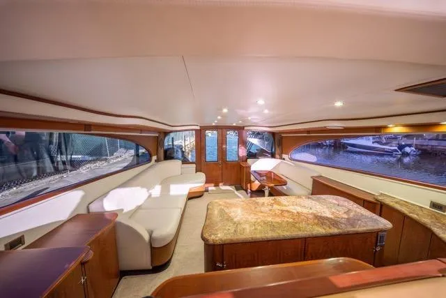  Yacht Photos Pics Luxurious interior of a 1997 Garlington Convertible yacht with elegant seating and wood finishes.
