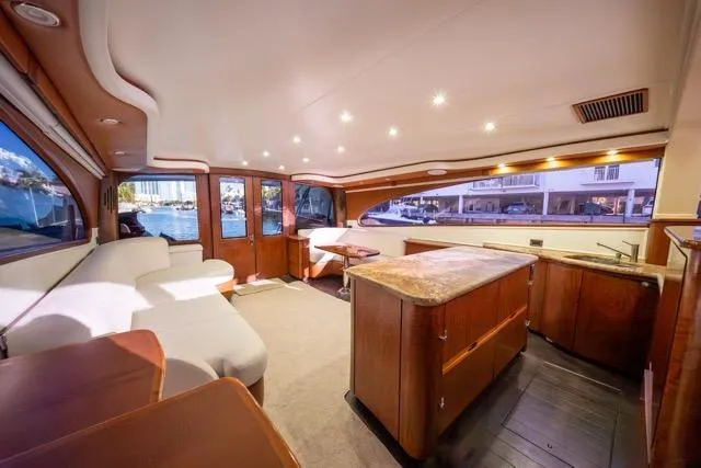  Yacht Photos Pics Luxurious interior of a 1997 Garlington Convertible yacht with elegant wood finishes.