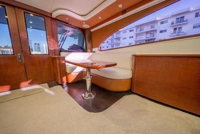  Yacht Photos Pics Interior of a 1997 Garlington Convertible yacht with elegant wood finish and seating area.