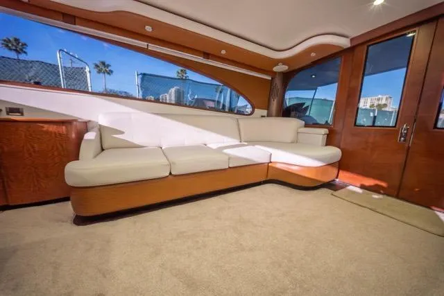  Yacht Photos Pics Luxurious interior of a 1997 Garlington Convertible yacht with plush seating and elegant wood finishes.