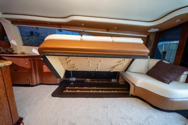  Yacht Photos Pics Luxurious 1997 Garlington Convertible yacht interior with hidden storage under seating.