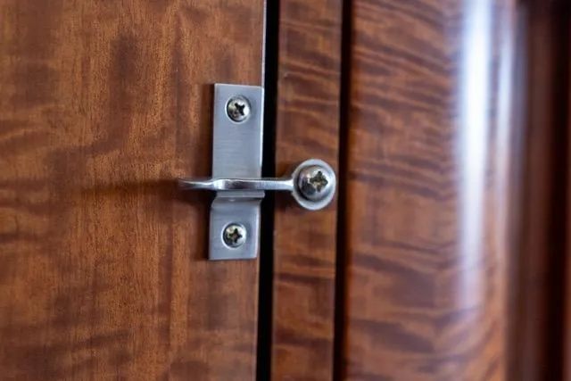  Yacht Photos Pics Close-up of a metal latch on a wooden surface, Garlington Convertible 1997.