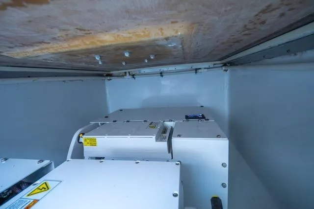  Yacht Photos Pics Interior view of 1997 Garlington Convertible engine compartment with machinery.