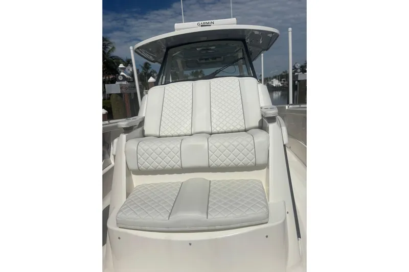  Yacht Photos Pics 2021 Pursuit S 378 Sport boat with luxurious white quilted seating.