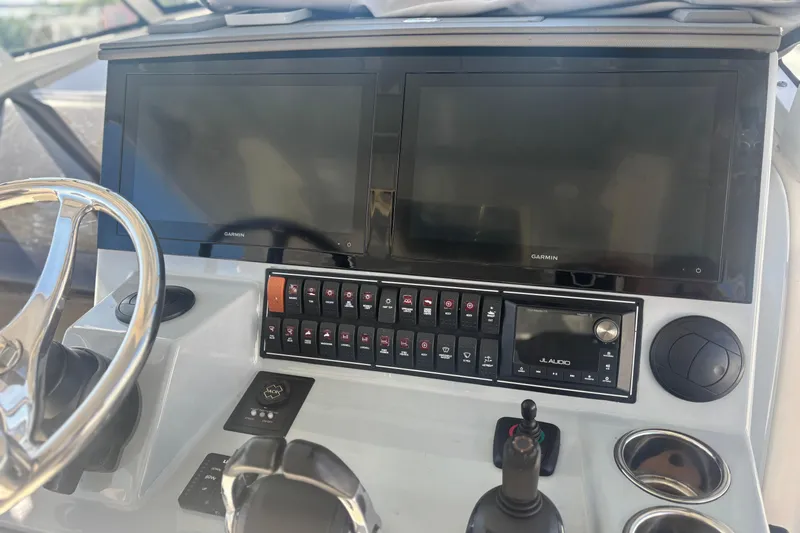  Yacht Photos Pics 2021 Pursuit S 378 Sport boat dashboard with Garmin displays and JL Audio system.