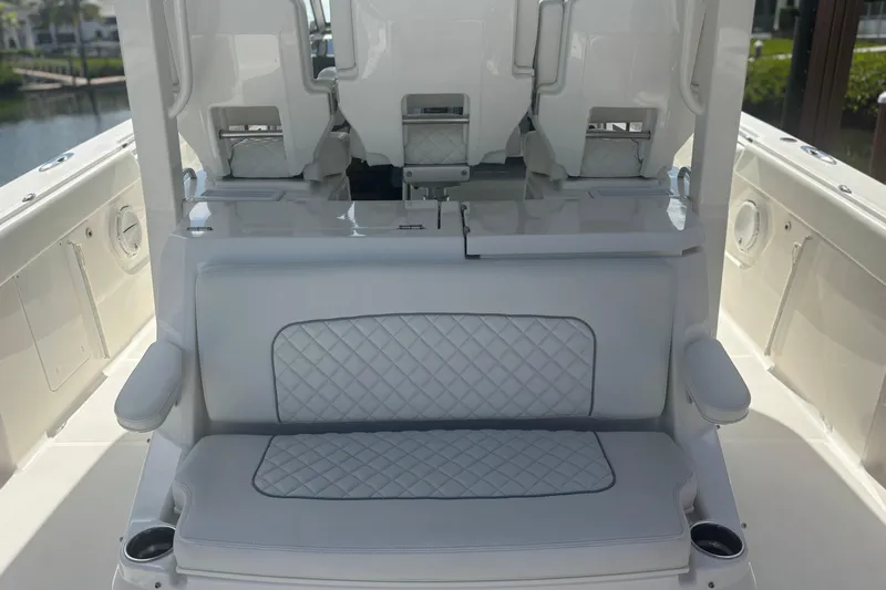 Yacht Photos Pics 2021 Pursuit S 378 Sport boat interior with cushioned seating and armrests.