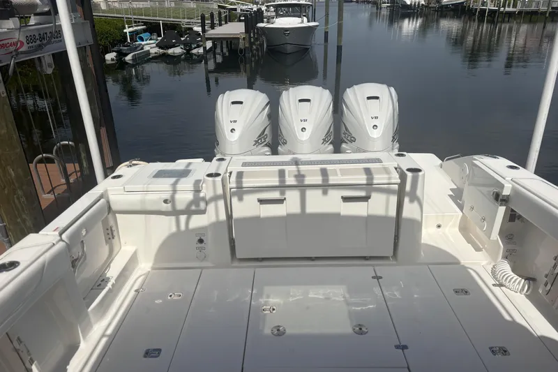  Yacht Photos Pics 2021 Pursuit S 378 Sport boat with triple V8 engines docked at marina.