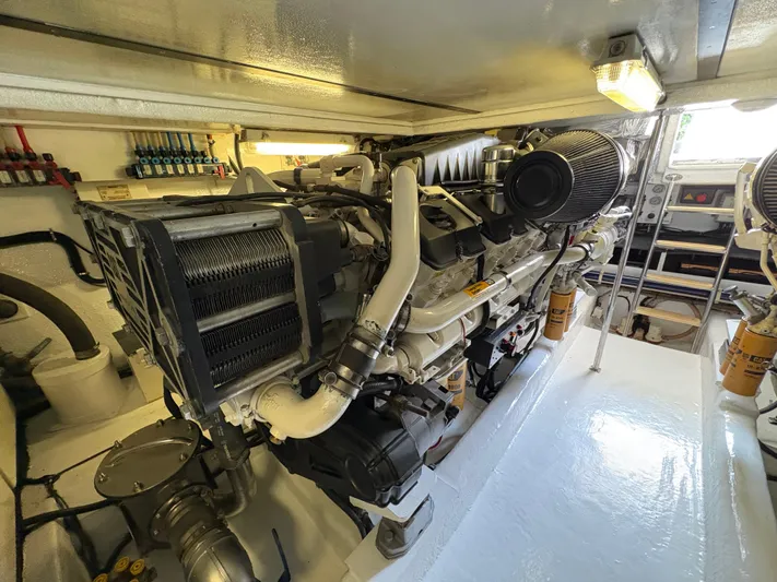 Obelix Yacht Photos Pics Engine room of 2006 Riviera 60 Flybridge yacht, showcasing powerful machinery and clean layout.