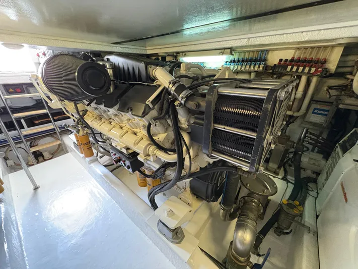 Obelix Yacht Photos Pics Engine room of 2006 Riviera 60 Flybridge yacht, showcasing detailed machinery and components.