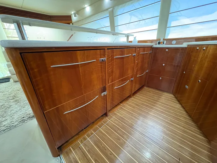 Obelix Yacht Photos Pics Luxurious wooden cabinetry in 2006 Riviera 60 Flybridge yacht interior.