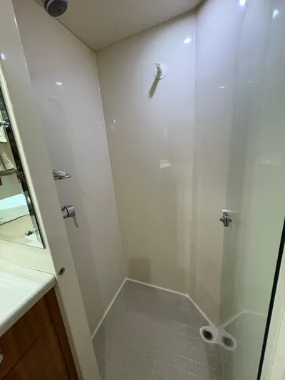 Obelix Yacht Photos Pics Shower area in 2006 Riviera 60 Flybridge yacht, featuring sleek design and modern fixtures.