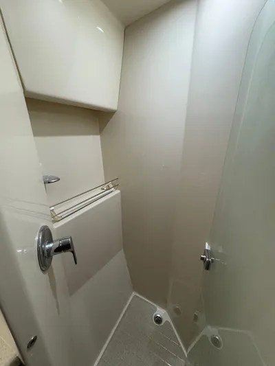 Obelix Yacht Photos Pics Shower area in a 2006 Riviera 60 Flybridge yacht, featuring modern fixtures and sleek design.