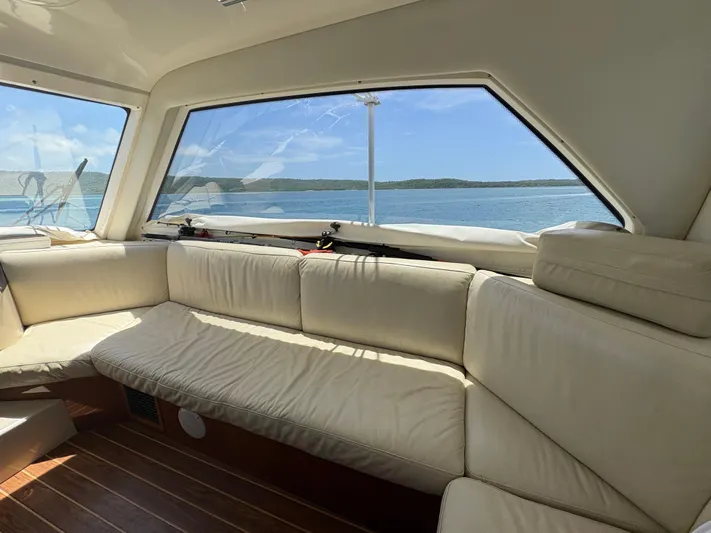 Obelix Yacht Photos Pics Luxurious interior of 2006 Riviera 60 Flybridge yacht with ocean view.