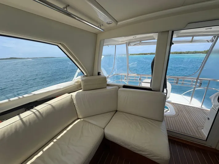 Obelix Yacht Photos Pics Luxurious interior of 2006 Riviera 60 Flybridge yacht with ocean view.