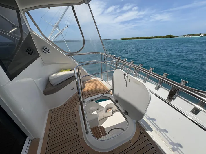 Obelix Yacht Photos Pics 2006 Riviera 60 Flybridge yacht deck with ocean view and seating area.