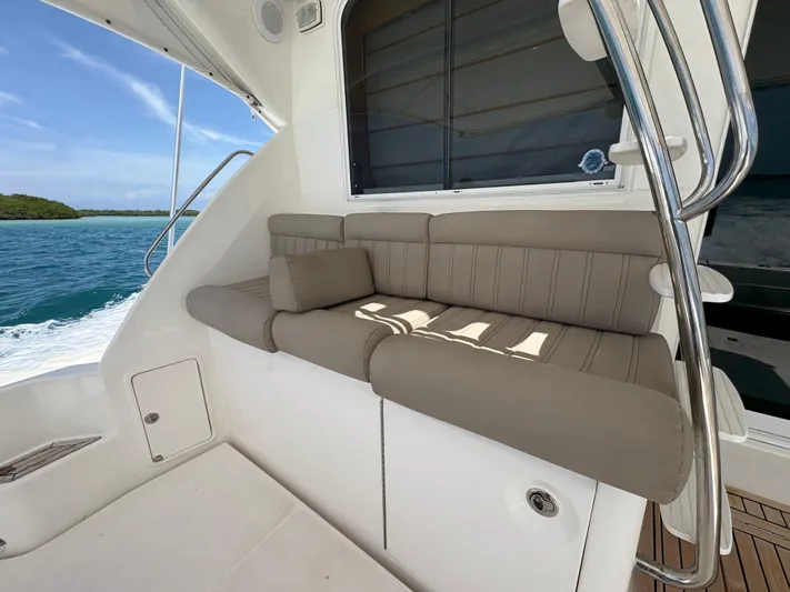 Obelix Yacht Photos Pics Luxurious seating on 2006 Riviera 60 Flybridge yacht with ocean view.