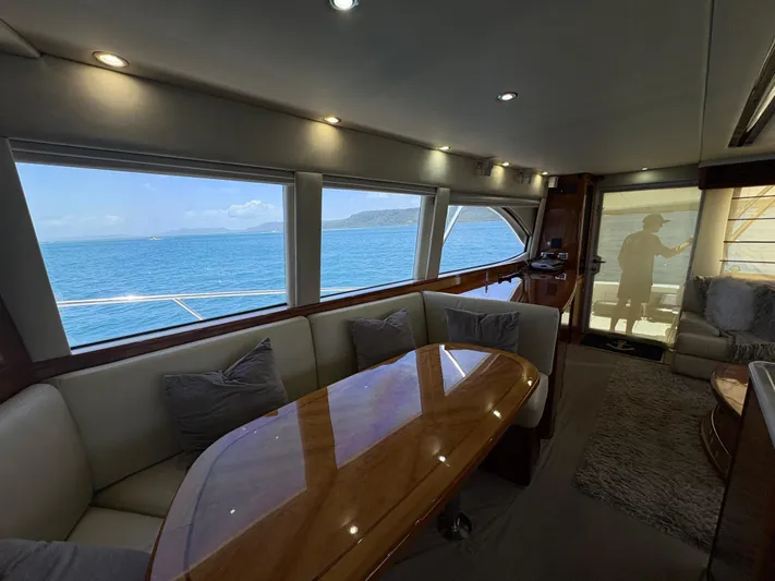 Obelix Yacht Photos Pics Luxurious interior of 2006 Riviera 60 Flybridge yacht with ocean view.