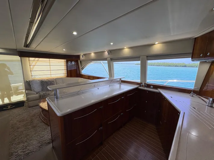 Obelix Yacht Photos Pics Luxurious interior of 2006 Riviera 60 Flybridge yacht with ocean view.