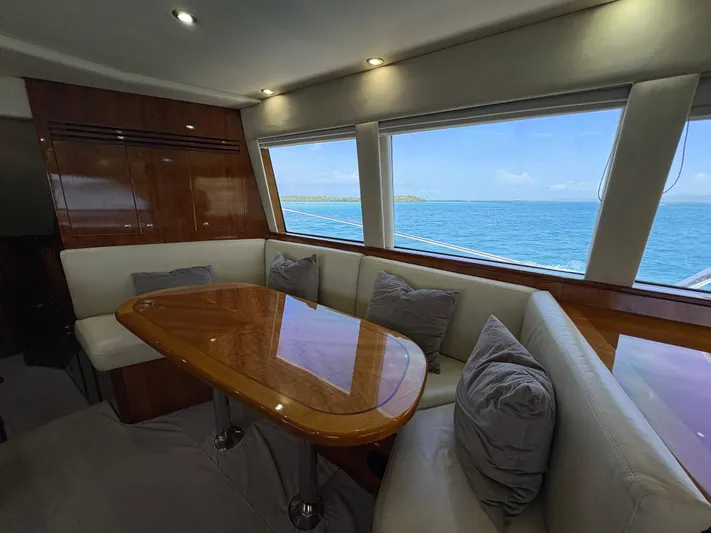 Obelix Yacht Photos Pics Luxurious interior of 2006 Riviera 60 Flybridge yacht with ocean view.