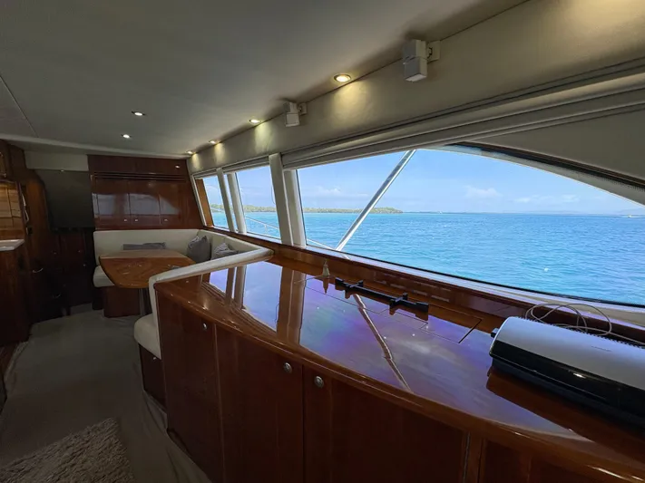 Obelix Yacht Photos Pics Luxurious interior of 2006 Riviera 60 Flybridge yacht with ocean view.