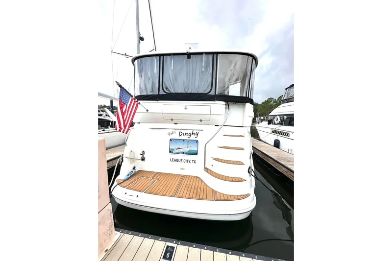 Debs Dinghy Yacht Photos Pics 2007 Sea Ray 40 Motor Yacht docked, rear view with American flag, League City, TX.