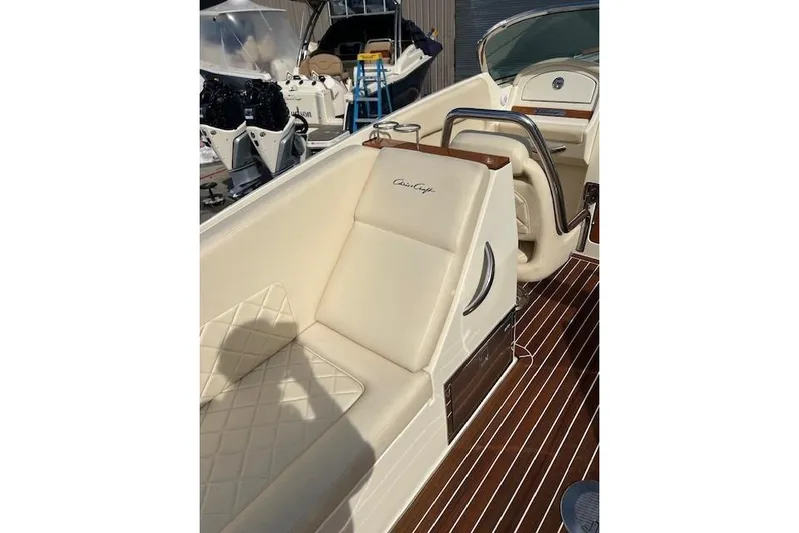  Yacht Photos Pics 2017 Chris-Craft Corsair 32 boat interior with cream leather seating and wood accents.