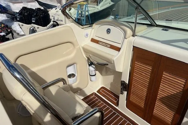  Yacht Photos Pics 2017 Chris-Craft Corsair 32 interior with beige seating and wooden accents.