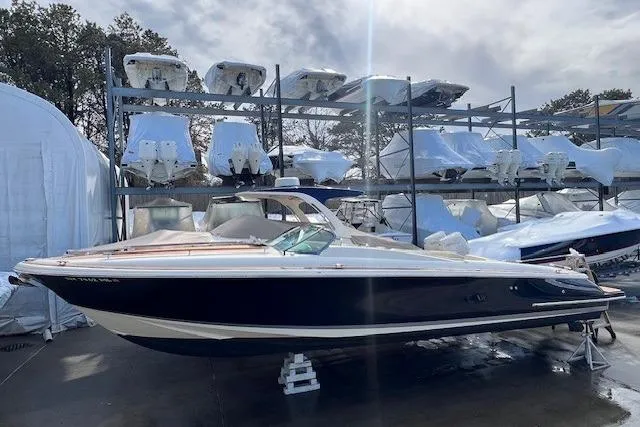  Yacht Photos Pics 2017 Chris-Craft Corsair 32 boat in storage, surrounded by other covered boats.