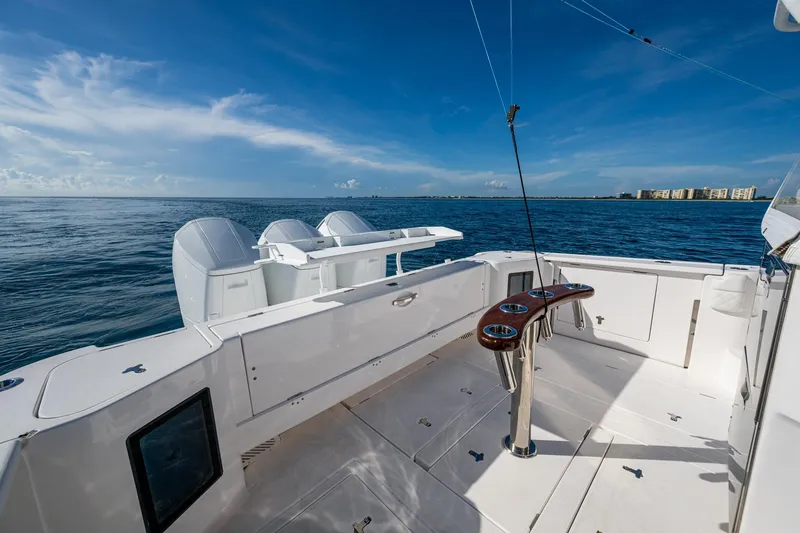 Rising Tide Yacht Photos Pics 2023 Intrepid 477 Evolution boat deck with ocean view and clear blue sky.