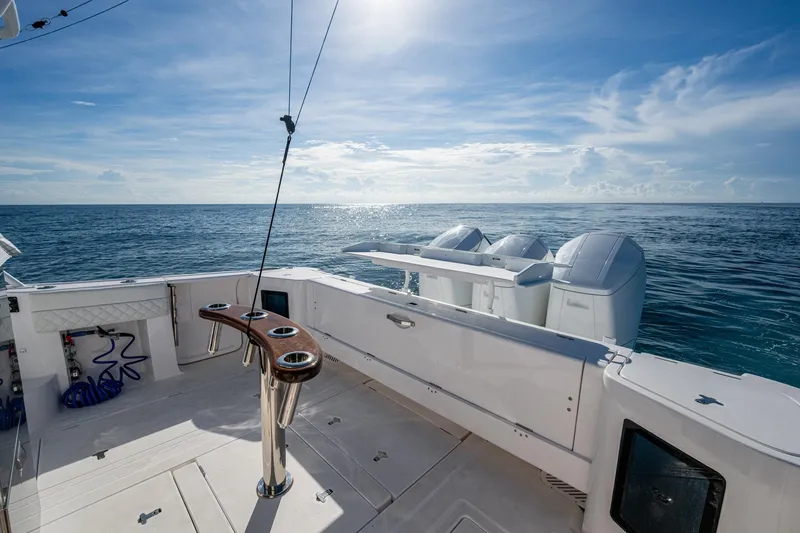 Rising Tide Yacht Photos Pics 2023 Intrepid 477 Evolution boat deck with ocean view and outboard motors.