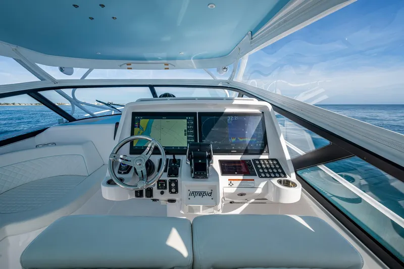 Rising Tide Yacht Photos Pics Cockpit of 2023 Intrepid 477 Evolution yacht with advanced navigation system.