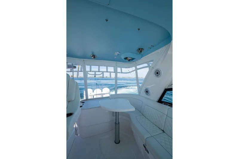 Rising Tide Yacht Photos Pics Interior of 2023 Intrepid 477 Evolution yacht with seating and ocean view.