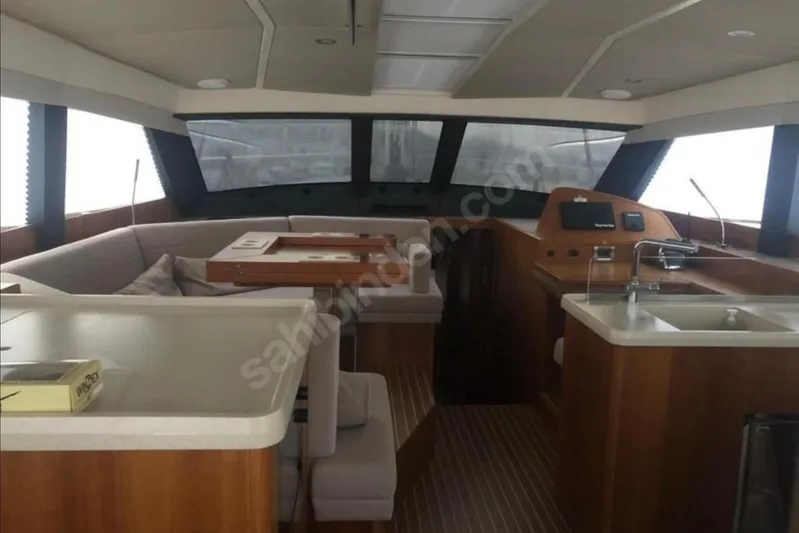 Moody Ds 54 Yacht Photos Pics Luxurious interior of 2019 Moody DS 54 yacht with modern kitchen and seating area.