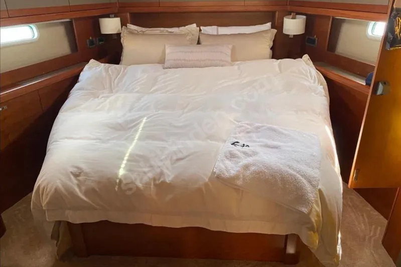 Moody Ds 54 Yacht Photos Pics Luxurious bedroom interior of 2019 Moody DS 54 yacht with cozy bedding.