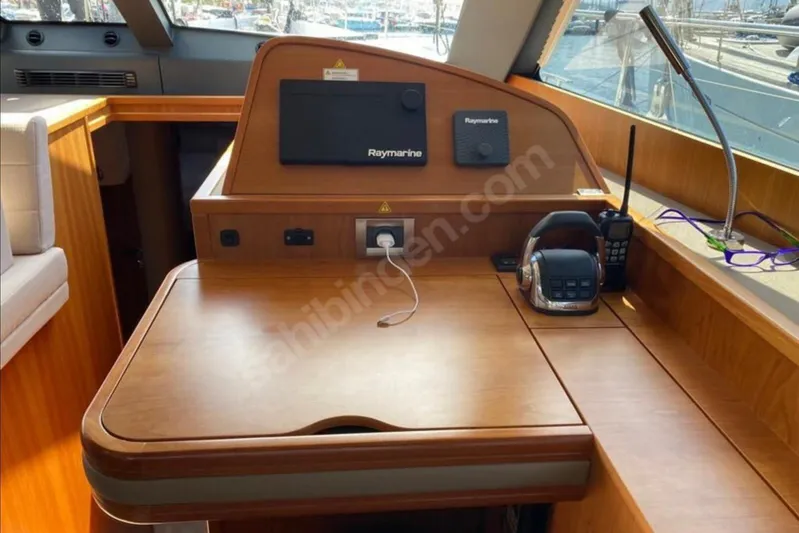 Moody Ds 54 Yacht Photos Pics 2019 Moody DS 54 yacht interior with navigation equipment and wooden finish.