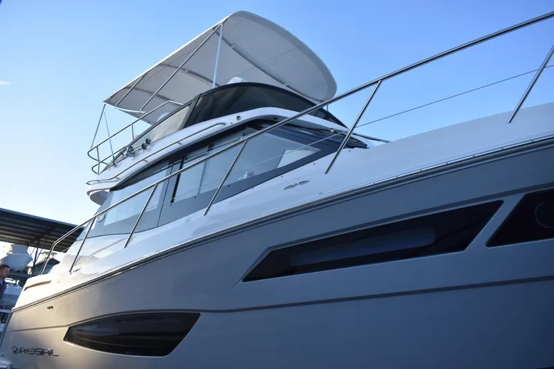  Yacht Photos Pics 2025 Regal 38 FXO yacht with sleek design and modern features, viewed from below.