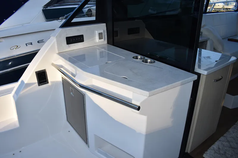  Yacht Photos Pics 2025 Regal 38 FXO yacht interior with sleek countertop and modern amenities.