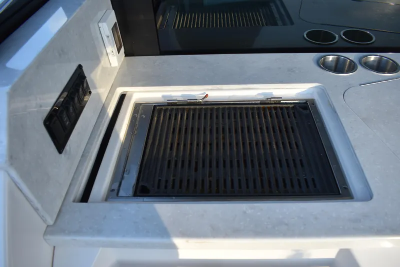  Yacht Photos Pics Built-in grill on 2025 Regal 38 FXO yacht, featuring sleek countertop design.