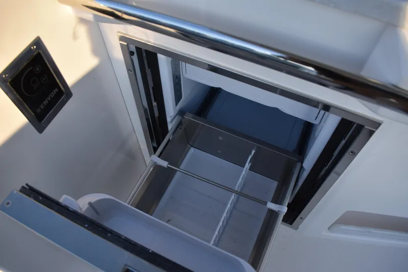  Yacht Photos Pics Open drawer on 2025 Regal 38 FXO boat, featuring Kenyon control panel.
