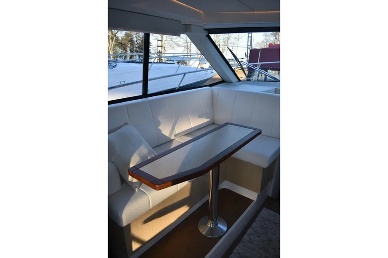 Yacht Photos Pics Interior of 2025 Regal 38 FXO yacht with elegant seating and table.