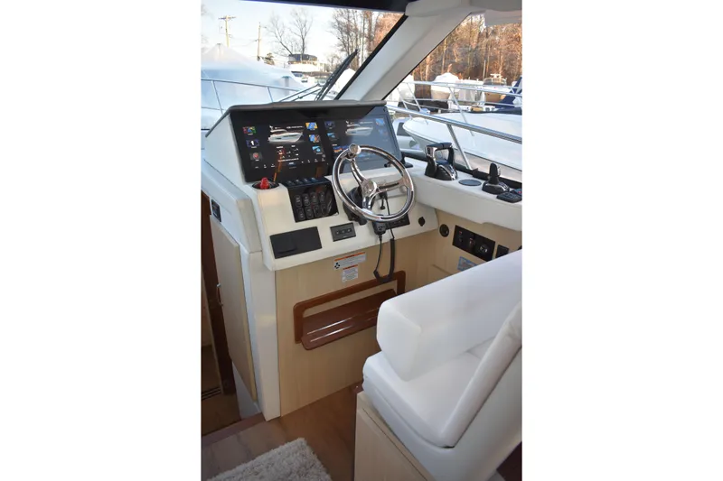 Yacht Photos Pics 2025 Regal 38 FXO yacht helm with modern controls and navigation display.