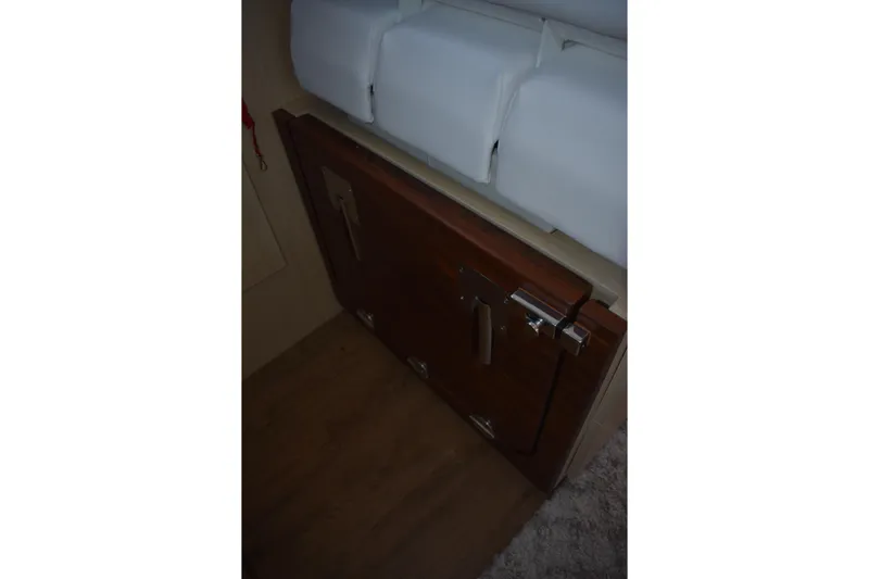  Yacht Photos Pics Cabinet door inside 2025 Regal 38 FXO boat interior, featuring sleek wooden finish.