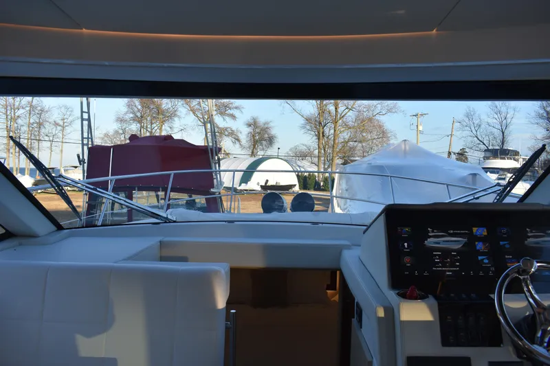  Yacht Photos Pics Interior view of 2025 Regal 38 FXO yacht cockpit with modern dashboard.