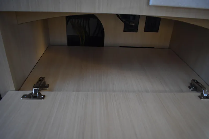  Yacht Photos Pics Empty wooden cabinet interior with hinges, Regal 38 FXO 2025 model.