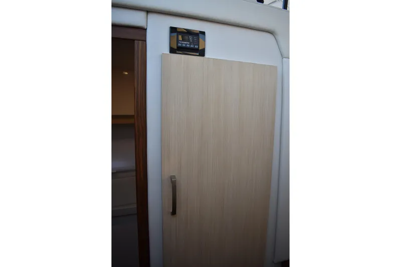  Yacht Photos Pics Interior door of 2025 Regal 38 FXO yacht, featuring modern design and sleek handle.