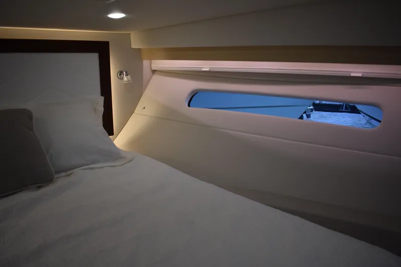  Yacht Photos Pics Luxurious interior cabin of 2025 Regal 38 FXO yacht with window view.