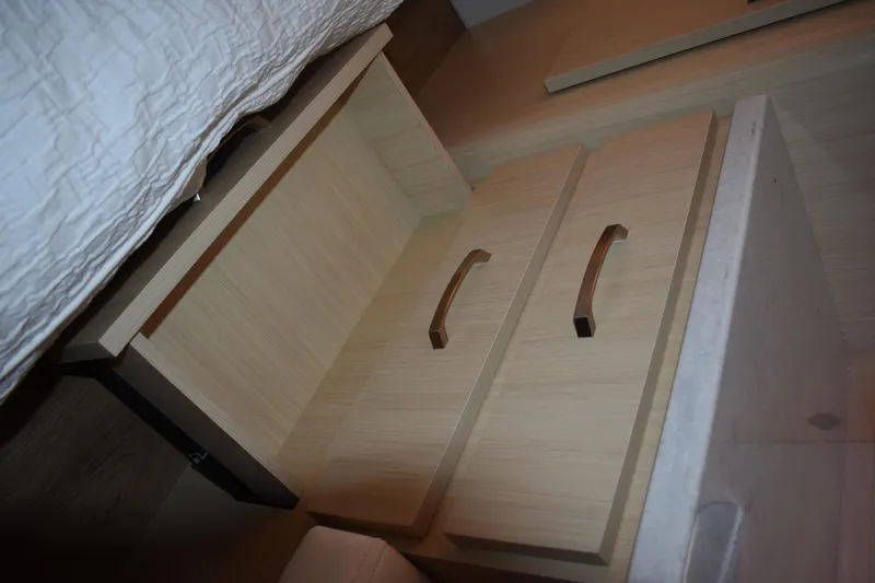  Yacht Photos Pics Wooden cabinet with open drawer, featuring sleek handles, inside a 2025 Regal 38 FXO.