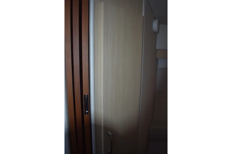  Yacht Photos Pics Interior view of 2025 Regal 38 FXO yacht, featuring sleek wooden door design.