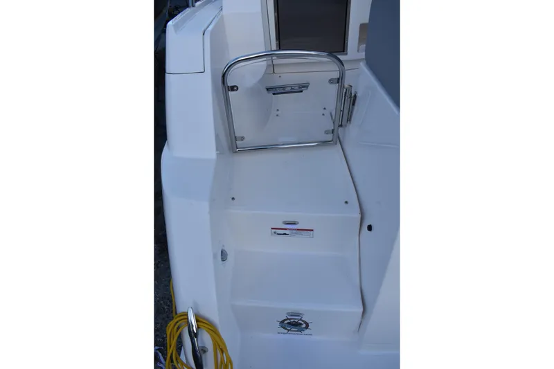  Yacht Photos Pics 2025 Regal 38 FXO boat deck with steps and safety gate.